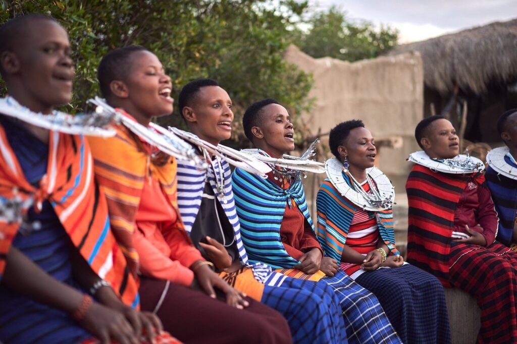 Maasai women in traditional clothing singing