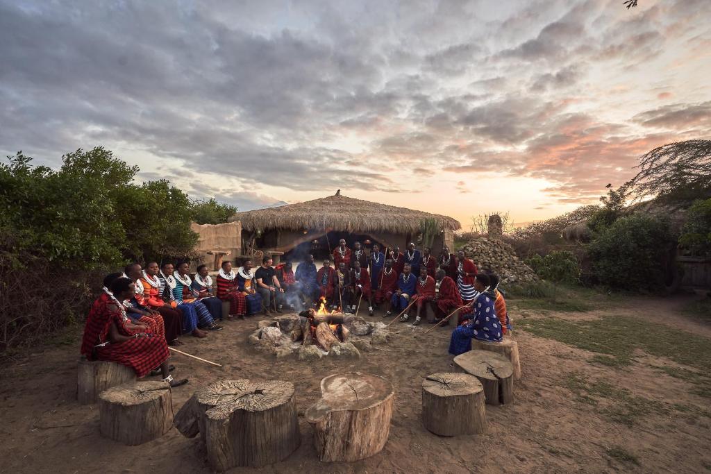 Maasai sitting around a bonfire