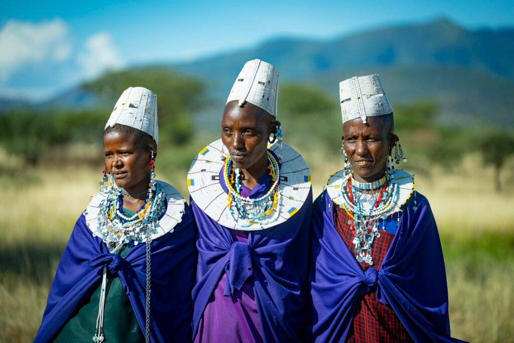 Three Maasai women in traditional clothing