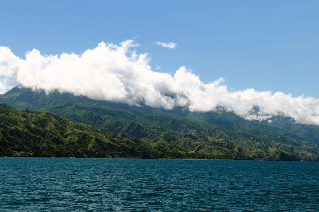 Lake Malawai with green mountains in the clouds