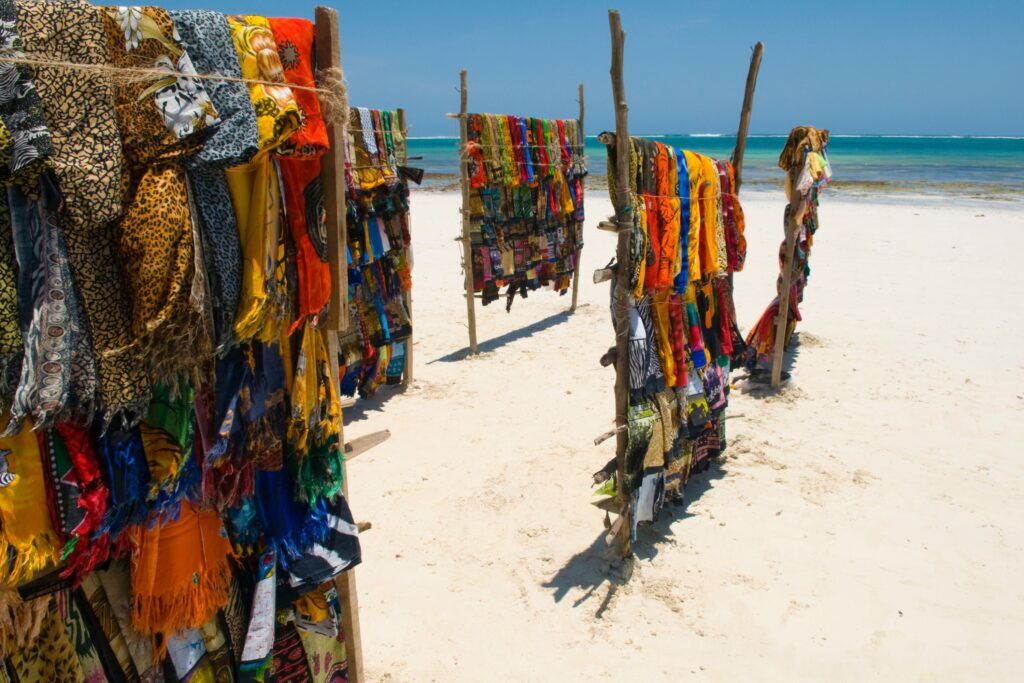 Colourful Kanga clothing at racks at the beach